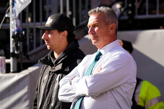 Former Ohio State Buckeyes head coach Urban Meyer watches from the sideline during the first half of the NCAA football game between the Buckeyes and the Michigan Wolverines at Ohio Stadium.